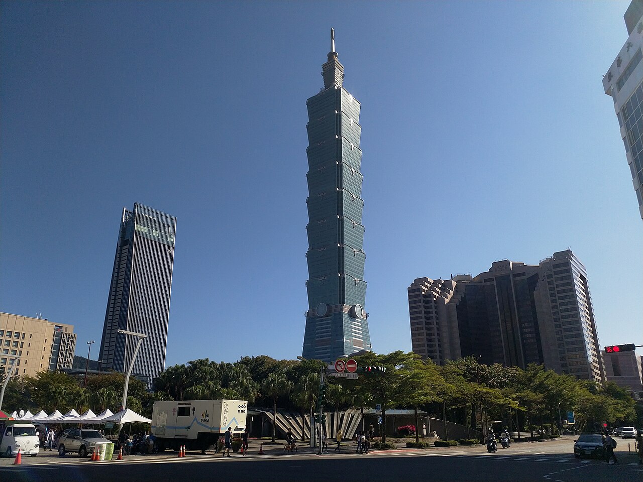 Street-level view of Taipei 101, Nan Shan Plaza and Grand Hyatt beside City Hall Plaza